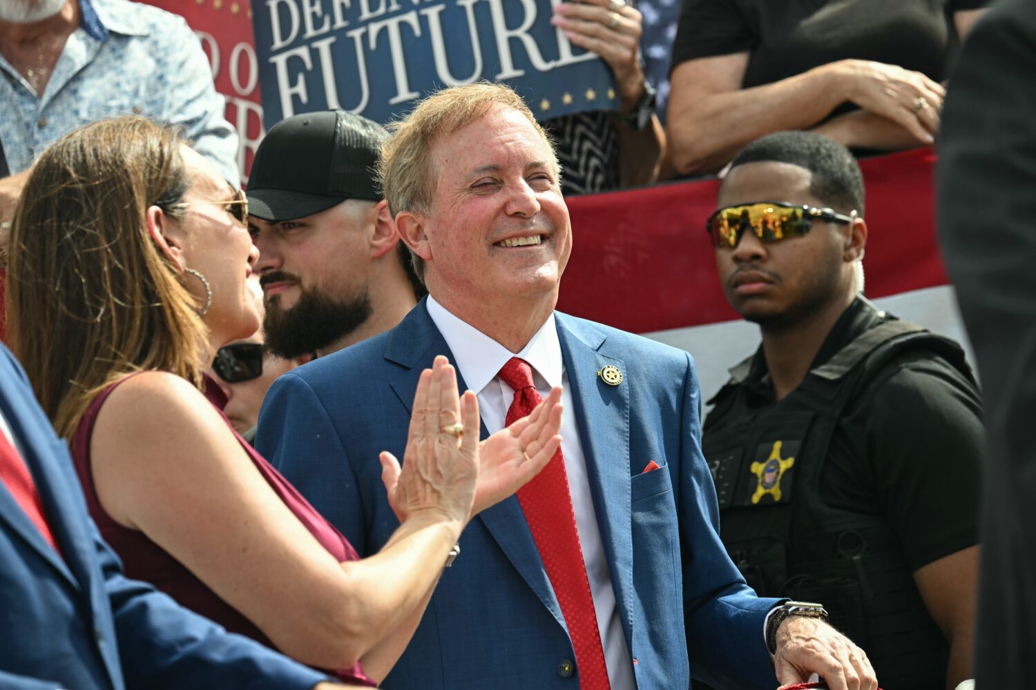 Texas Attorney General and Republican Senate candidate Ken Paxton smiles as Vice President JD Vance...