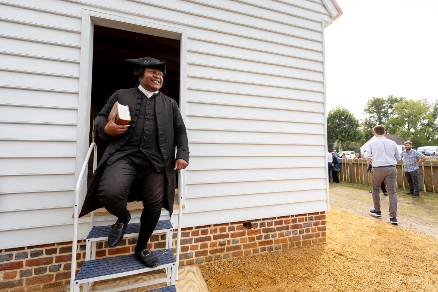 Joe Feaster, a part-time historical interpreter who portrays pastor Gowan Pamphlet, steps out of th...