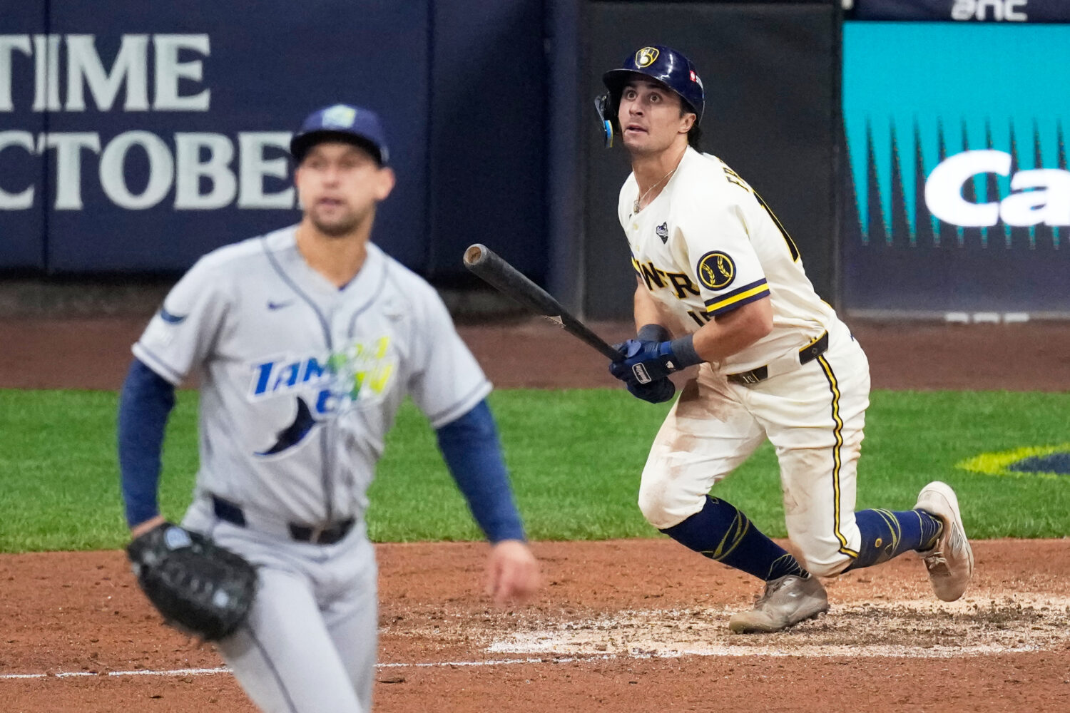 Milwaukee Brewers' Sal Frelick watches his home run during the sixth inning of Game 2 of baseball's...