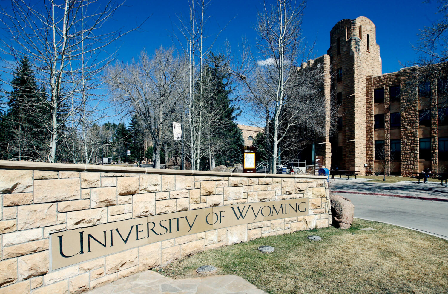 FILE - The University of Wyoming campus sign is seen with the Wyoming Union in the background on Ma...