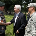 Defense Secretary Robert Gates shake hands with Korean veteran Craig Gerhartz as he arrives to speak at the Memorial Day weekend Rolling Thunder event on the National Mall in Washington on Sunday, May 29, 2011. (AP Photo/Jose Luis Magana)