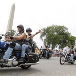 Participants in the Rolling Thunder annual motorcycle rally ride past the Washington Monument on the National Mall during the Memorial Day weekend in Washington, May 29, 2011. (AP Photo/Manuel Balce Ceneta)