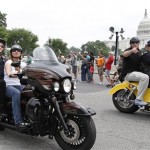 Sarah Palin, former GOP vice presidential candidate and Alaska governor, rides on the back of a motorcycle at the Rolling Thunder annual motorcycle rally, past the U.S. Capitol during the Memorial Day weekend rally in Washington, May 29, 2011. (AP Photo/Manuel Balce Ceneta)