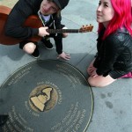 Fans take pictures with a plaque commemorating 
Whitney Houston's Record of the Year and Album 
of the Year for the 36th Grammy Awards, at LA 
Live in Los Angeles, on Sunday, Feb. 12, 2012. 
Houston died Saturday, Feb. 11, 2012, on the 
eve of the Grammys, at the Beverly Hilton 
Hotel, where she was preparing to attend a pre-
Grammy party. (AP Photo/Ringo H.W. Chiu)