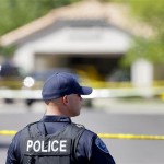 A Gilbert police officer stands outside the 
police tape outside a crime scene Wednesday, 
May 2, 2012 in Gilbert, Ariz. Police in the 
Phoenix suburb of Gilbert say a man shot and 
killed four people, including a toddler, before 
killing himself. (AP Photo/Matt York)