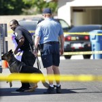 Gilbert police officers load a dog into a truck 
after it was removed from the crime scene 
Wednesday, May 2, 2012 in Gilbert, Ariz. 
Authorities in Gilbert say there has been a 
multi person shooting in the 500 block of West 
Tumbleweed Rd. (AP Photo/Matt York)