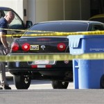 Gilbert police officers walk inside the police 
tape outside a crime scene Wednesday, May 2, 
2012 in Gilbert, Ariz. A man fatally shot four 
people, including a toddler, at a home in a 
Phoenix suburb before killing himself 
Wednesday, authorities said. (AP Photo/Matt 
York)