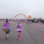 Daphne Brass (right) tells her mom to stop taking pictures and start running toward the finish at the The Color Run 5K. (Photo: Amy Donaldson)