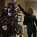 Aubree Thompson placing her Angel on top of the tree. (Photo: Ashlynn Green, Screamo Productions)
