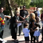 Cindy Jones, widow of Glendale Officer Brad Jones, accepts flowers at a brief ceremony in her husband's honor Oct. 29, 2012. Jones died on duty exactly one year ago. (Photo: Jim Cross/KTAR)