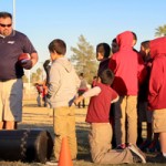 ASU Preparatory Academy students takes part in a youth football camp provided by Pac-12 and ASU in addition to the school's technology upgrade.