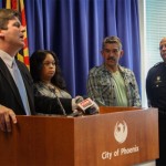 Phoenix Mayor Greg Stanton (left) talks about left-center) and Richard Bounds (right-center), alongside Phoenix Police Chief Daniel Garcia (right), during the course of a deadly bank robbery in Phoenix last December. (Mark Remillard/KTAR Photo)
