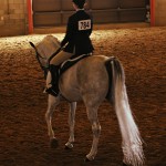 Gabriela Burshteyn in the warm-up area with her horse, SQR Karee.