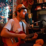 Playing to Heal Founder Serop Sayadian plays his guitar in a studio. (Facebook Photo)