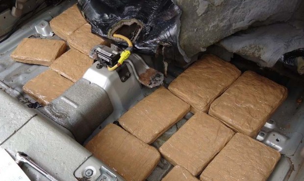 Drug smugglers attempted to conceal marijuana packages throughout the vehicle, including within the...