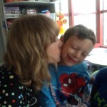Taylor Swift kisses Jordan Nickerson at Boston Children's Hospital. (Facebook Photo)