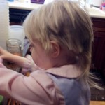 My 3-year-old displays the toddler-sized mullet she gave herself. (Photo: Erin Stewart)