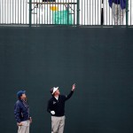 Phil Mickelson, center, waves after a volunteer dropped him his ball after hitting over a hospitality tent on the 11th hole during the first round of the Phoenix Open golf tournament, Thursday, Jan. 29, 2015, in Scottsdale, Ariz. (AP Photo/Rick Scuteri)