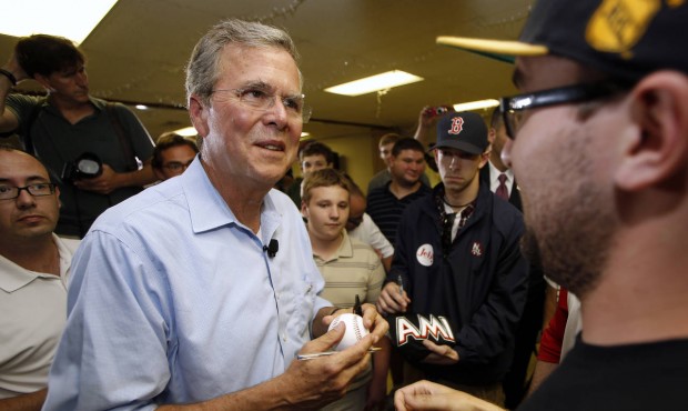 Republican presidential candidate former Florida Gov. Jeb Bush signs autographs following a town ha...