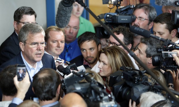 Former Florida Gov. Jeb Bush talks with reporters following a meeting with seacoast area business l...