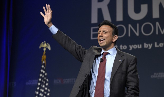 Louisiana Gov. Bobby Jindal waves while speaking during Rick Scott’s Economic Growth Summit i...