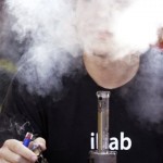 Cody Park exhales a cloud of marijuana smoke after taking a hit on a bong at the first day of Hempfest, Friday, Aug. 16, 2013, in Seattle. Thousands packed the Seattle waterfront park for the opening of a three-day marijuana festival 