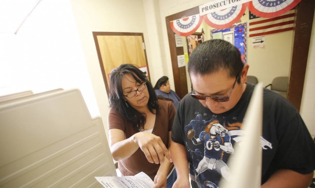 Alberta King, office administrator with the Navajo Election Administration, explains the ballot to ...