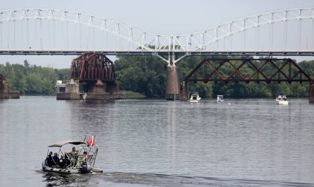 Authorities search the Connecticut River near the Arrigoni Bridge for a missing child, Monday, July...