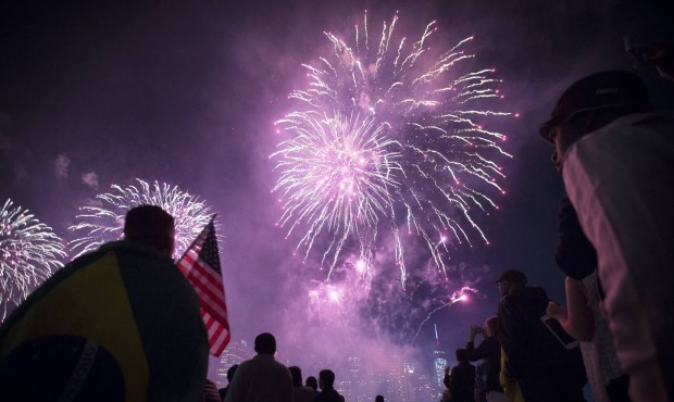 FILE – In this Friday, July 4, 2014 file photo, fireworks light up the lower Manhattan skylin...
