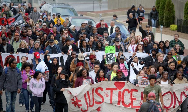 Supporters of Tony Robinson’s family participate in a march along E. Wilson St., Tuesday, May...