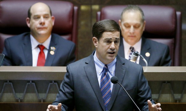 Arizona Republican Gov. Doug Ducey, front, gives his state-of-the-state address as Arizona House sp...