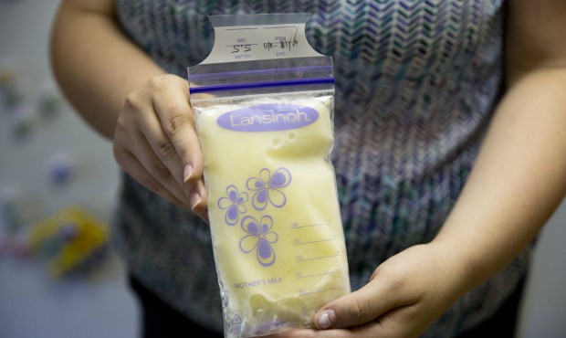 Rachel Palencik poses for a photograph with her frozen breast milk Wednesday, June 17, 2015, in Wes...
