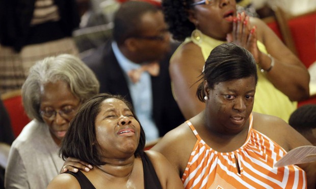 Parishioners sing at the Emanuel A.M.E. Church four days after a mass shooting that claimed the liv...