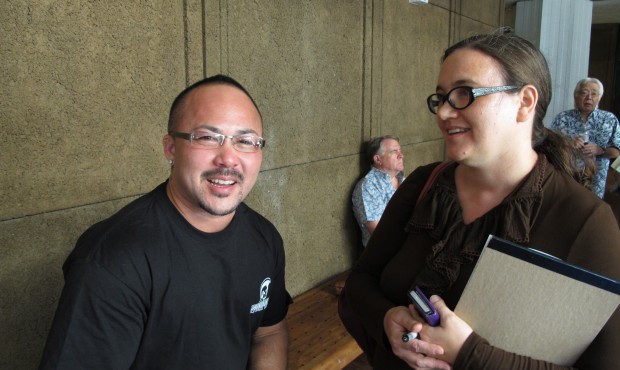 Kaleo Ramos, left, and Rebecca Copeland, right, react outside a legislative hearing room on Thursda...