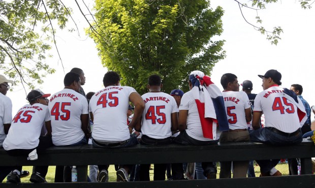 Pedro Martinez fans sit on a fence at the Clark Sports Center before the National Baseball Hall of ...