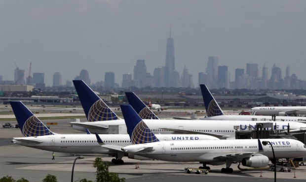 FILE – In this Tuesday, July 22, 2014, file photo, United Airlines jets are parked on the tar...