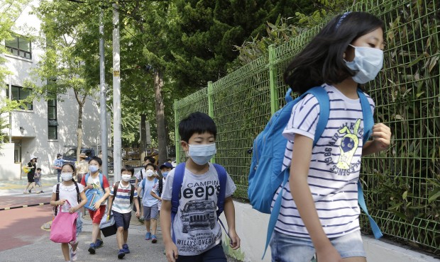 South Korean elementary school students wearing masks as a precaution against the Middle East Respi...