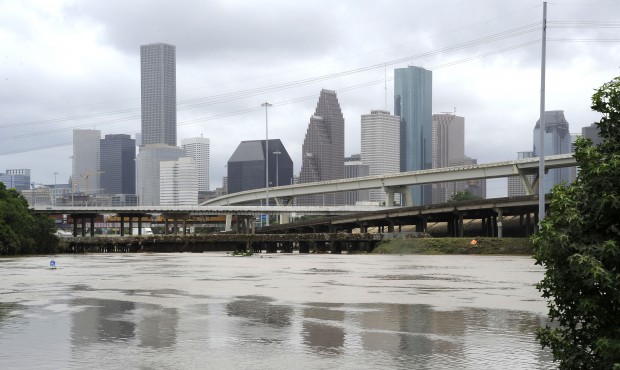 Flood waters overrun the banks of the bayou in downtown Houston, Tuesday, May 26, 2015. Floodwaters...