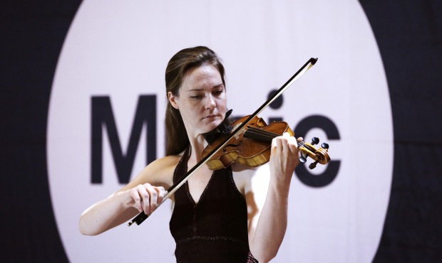 Rebekah Butler, whose stage name is “Becka Jay,” plays solo violin as she auditions for...