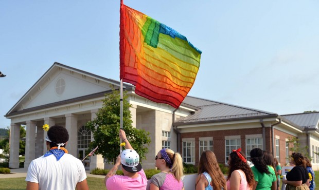 Protesters waive a rainbow flag on the front lawn of the Rowan County Judicial Center, Tuesday, Jun...