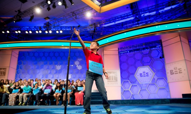 Kasey Torres, 10, of San Angelo, Texas, reaches up for the microphone as he takes the stage during ...