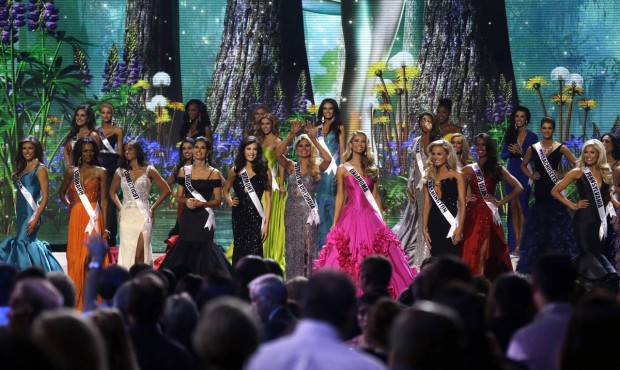 FILE – In this July 8, 2015 file photo, contestants wave onstage at the conclusion of the pre...