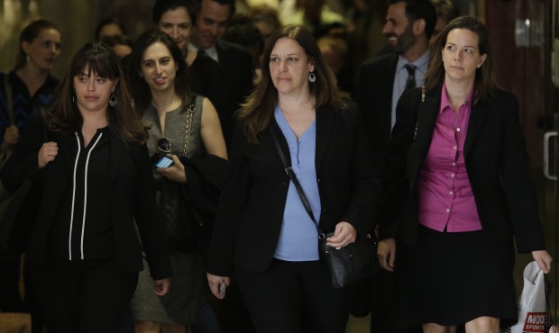Assistant District Attorney Joan Illuzzi-Orbon, center, leaves at the end of the day in the trial o...