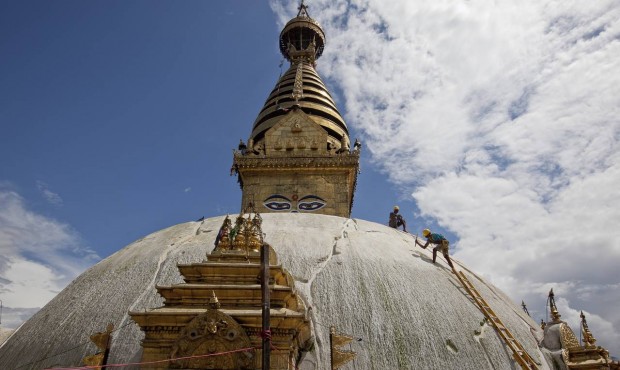 Nepalese laborers work on reconstructing the earthquake damaged Swayambhunath Stupa in Kathmandu, N...