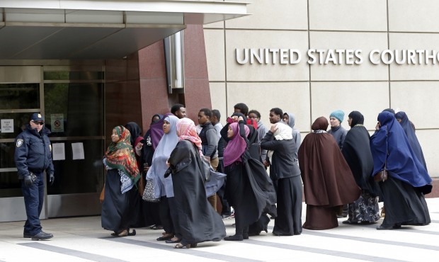 Members of the Minneapolis Somali community wait Tuesday, May 12, 2015, to enter the United States ...