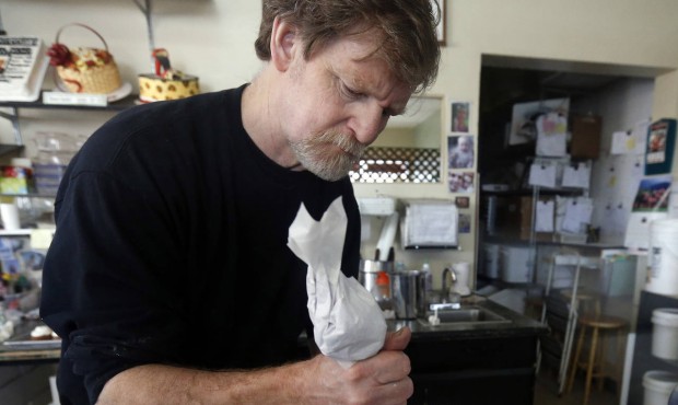 File – In this March 10, 2014 file photo, Masterpiece Cakeshop owner Jack Phillips decorates ...