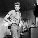               FILE - This 1955 file photo shows actor James Dean. Until the 1950s, jeans had been called overalls or waist overalls, but after teens started referring to them as jeans, Levi’s began using the moniker in ads and packaging. Around the same time, jeans took on a bad-boy image, popularized by teen rebels like James Dean and Marlon Brandy, which led many schools to ban kids from wearing them to class. (AP Photo/File)
            