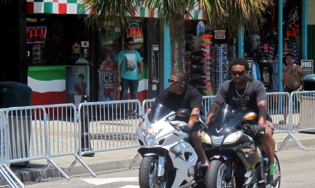 In this photo taken Tuesday, May 19, 2015, motorcyclists ride through Myrtle Beach, S.C. Tens of th...