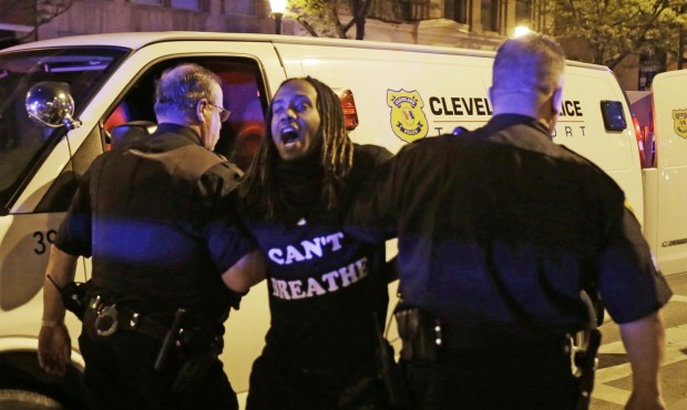 A protester is arrested after the acquittal of Michael Brelo, a patrolman charged in the shooting d...