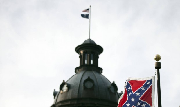 A Confederate battle flag flies in front of the South Carolina statehouse Wednesday, July 8, 2015, ...